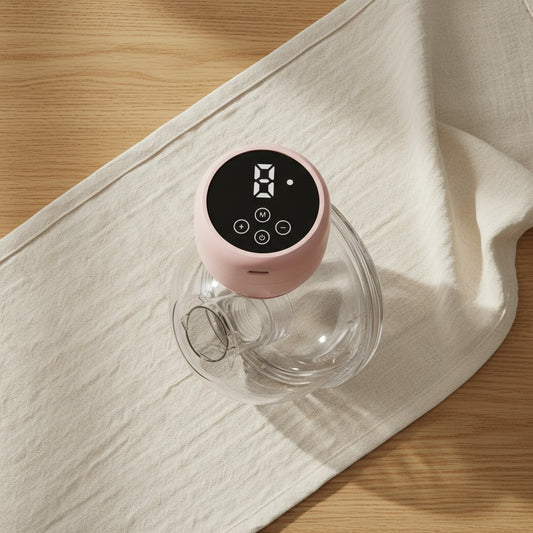 Wearable electric breast pump in pink with digital display for hands free milk expression